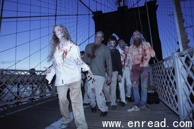 Costumed actors, promoting the Halloween premiere of the AMC television series 'The Walking Dead', shamble along the Brooklyn Bridge while posing for pictures in New York, Tuesday, Oct. 26, 2010.