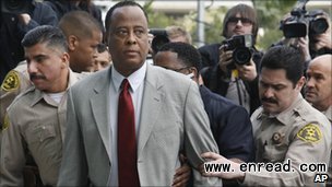 Conrad Murray (c) faces up to four years in prison if convicted