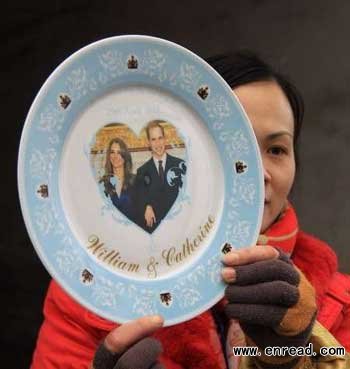 A technician showing a piece of royal wedding porcelain. 