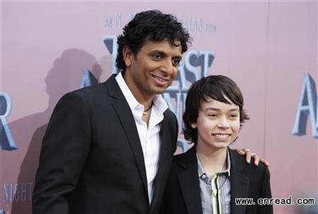 Director M. Night Shyamalan (L) and cast member Noah Ringer pose as they arrive for the premiere of the film ‘The Last Airbender‘ in New York June 30, 2010.