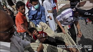 Protesters carried the injured to safety using makeshift stretchers