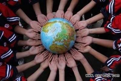 Students pose for the photo with a globe during a campaign to mark the World Earth Day in a middle school in Dexing, Jiangxi province April 19, 2011.