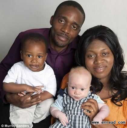 Black and white family: Francis and Arlette with Seth and Daniel.