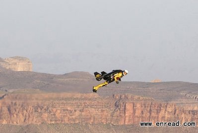 In this photo provided by Breitling, Swiss adventurer Yves Rossy is seen during his flight over the Grand Canyon in Arizona on Saturday, May 7, 2011, inhis custom-built jet suit.