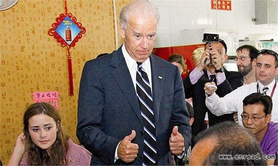 US Vice President Joe Biden gives a thumbs up during a chat with a patron at a restaurant during lunch in Beijing Thursday. Biden's meal cost 79 yuan ($12.36) for five people.