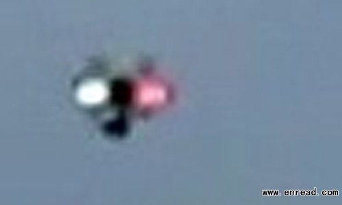 Bizarre footage has emerged of an apparent 'unidentified flying object' soaring above Moscow during a political protest.