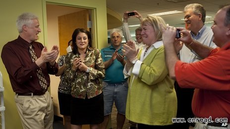Patriot-News reporter Sara Ganim (second left) and colleagues celebrate