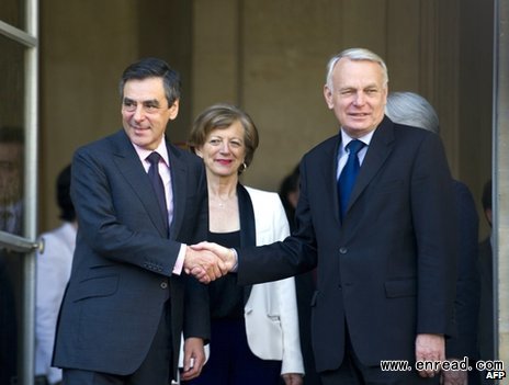 Mr Ayrault (right) shook hands with Mr Fillon outside the Matignon Palace