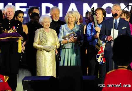 There was a deafening roar as the Queen, resplendent in a golden outfit, made her way to the centre of the 