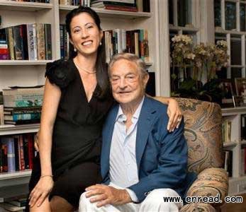 Billionaire investor George Soros and girlfriend Tamiko Bolton are pictured at Soros' residence in Southampton, New York August 11, 2012.