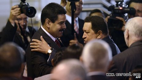 President Chavez (right) greets Nicolas Maduro, one of his closest allies