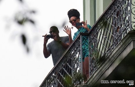 Beyonce is seen here on a balcony of the Saratoga Hotel in Havana next to her husband Jay Z on Friday