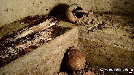 The tomb, opened for the first time, held vases and bones