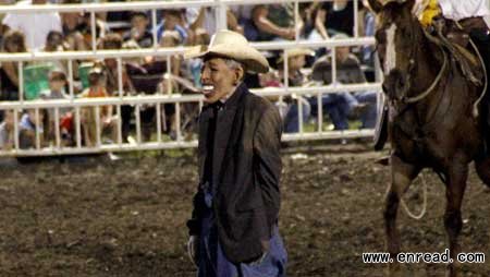 This photo provided by Jameson Hsieh shows a clown wearing a mask intended to look like President Obama at the Missouri State Fair.