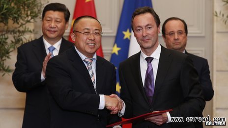 Airbus boss Fabrice Bregier shakes hands with Chinese official Li Hai in Paris