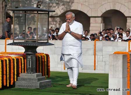 Narendra Modi visits the Mahatma Gandhi memorial in New Delhi before being sworn in as Indian prime minister on Monday.