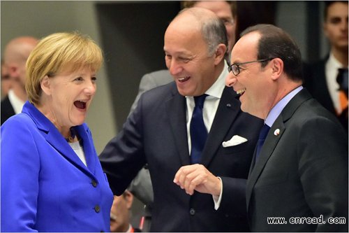 French President Francois Hollande (R) and France\s Foreign Affairs Minister Laurent Fabius joke with German <a href=