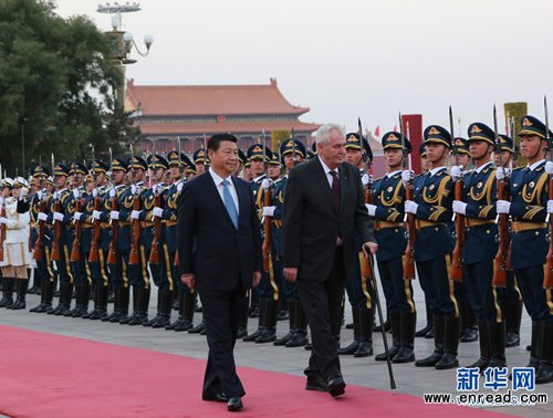 Chinese President Xi Jinping, left, and visiting Czech President Milos Zeman review guards of honor during a welcoming ceremony in Beijing on Monday, October 27, 2014.