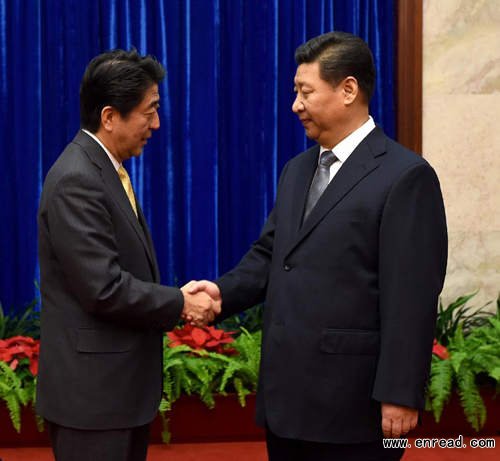 Chinese President Xi Jinping (R) and Japanese Prime Minister Shinzo Abe hold a meeting at the request of the Japanese side ahead of the 22nd Asia-Pacific Economic Cooperation (APEC) Economic Leaders' Meeting in Beijing, China, Nov. 10, 2014.