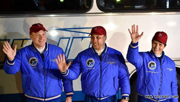 US astronaut Terry Virts (L), Russian cosmonaut Anton Shkaplerov (C) and European Space Agency's Italian astronaut Samantha Cristoforetti walk from their hotel to a bus during a sending-off ceremony in the Russian-leased Baikonur cosmodrome on November 23, 2014.