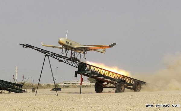 In this picture released by Jamejam Online on Thursday, Dec. 25, 2014, an Iranian made drone is launched during a military drill in Jask port, southern Iran.