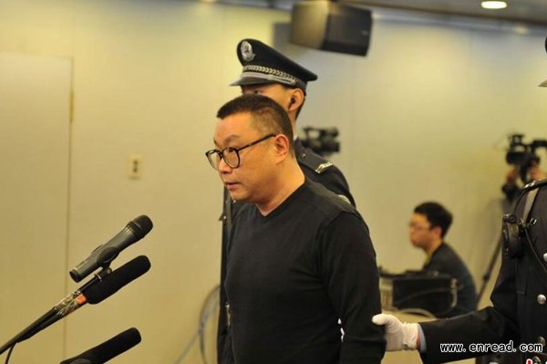 Singer Yin Xiangjie stands at the first trial where he was charged for the illegal consumption and possession of drugs at a local court in eastern Beijing on February 28, 2015.