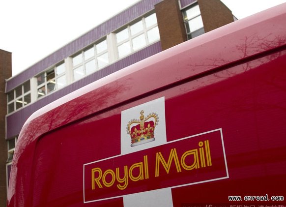 A delivery van with the royal mail livery parks outside the delivery office in Wimbledon, London, UK on 18 Dec 2014.