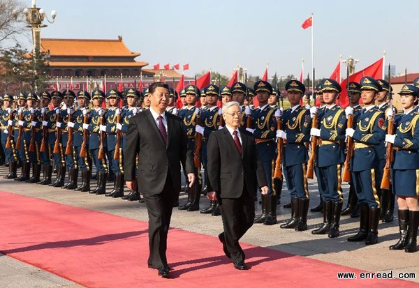 Chinese President Xi Jinping (L), who is also general secretary of the Central Committee of the Communist Party of China, holds a welcoming ceremony for Nguyen Phu Trong, general secretary of the Central Committee of the Communist Party of Vietnam, before their talks in Beijing, China, April 7, 2015.