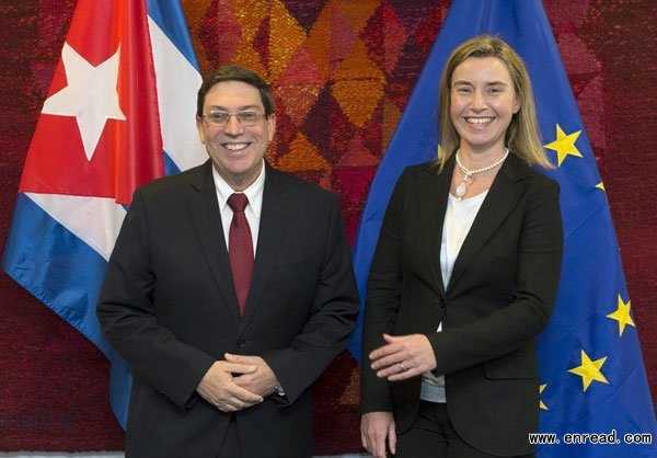 Cuba's Foreign Minister Bruno Rodriguez Parilla (L) is welcomed by European Union's Foreign Policy Chief Federica Mogherini in Brussels on April 22, 2015.