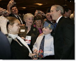 President George W. Bush poses for a photo after addressing the American Legion 47th National Convention, Tuesday, March 6, 2006, in Washington, D.C.  White House photo by Eric Draper