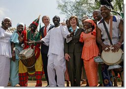 President George W. Bush and Mrs. Laura Bush stands with the Kankouran West African Dance Company after delivering remarks during a ceremony marking Malaria Awareness Day Wednesday, April 25, 2007, in the Rose Garden. "The American people, through their government, are working to end this epidemic,"said President Bush. "In 2005, President Bush announced the President's Malaria Initiative -- a five-year, $1.2 billion program to combat malaria in the hardest-hit African nations."  White House photo by Eric Draper