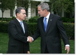 President George W. Bush and Colombia's President Alvaro Uribe exchange handshakes after delivering remarks Wednesday, May 2, 2007, on the South Lawn. President Uribe's visit underscores the friendship and extensive cooperation between the two countries. White House photo by Shealah Craighead