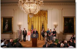 President George W. Bush, joined by families who were aided by the use of adult stem cells in their health treatments, addresses his remarks concerning his veto of S.5, the Stem Cell Research Enhancement Act of 2007, in the East Room of the White House Wednesday, June 20, 2007.  White House photo by Joyce N. Boghosian